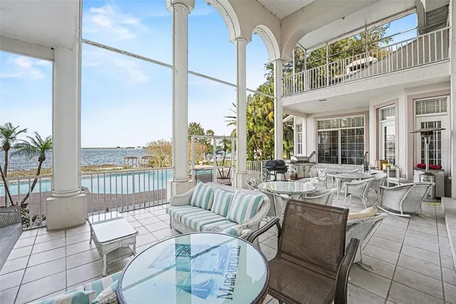 a view of a livingroom with kitchen and furniture