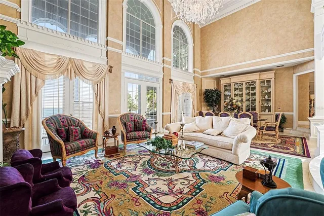 a bedroom with a bed couch and a window