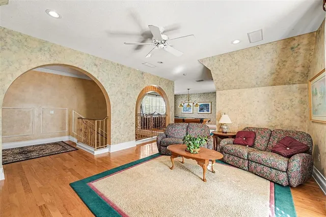 an aerial view of a house with a yard and garden