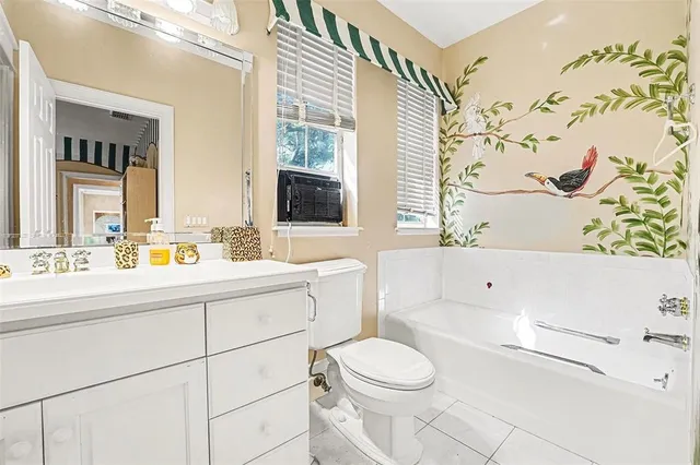 a view of a lake with lawn chairs