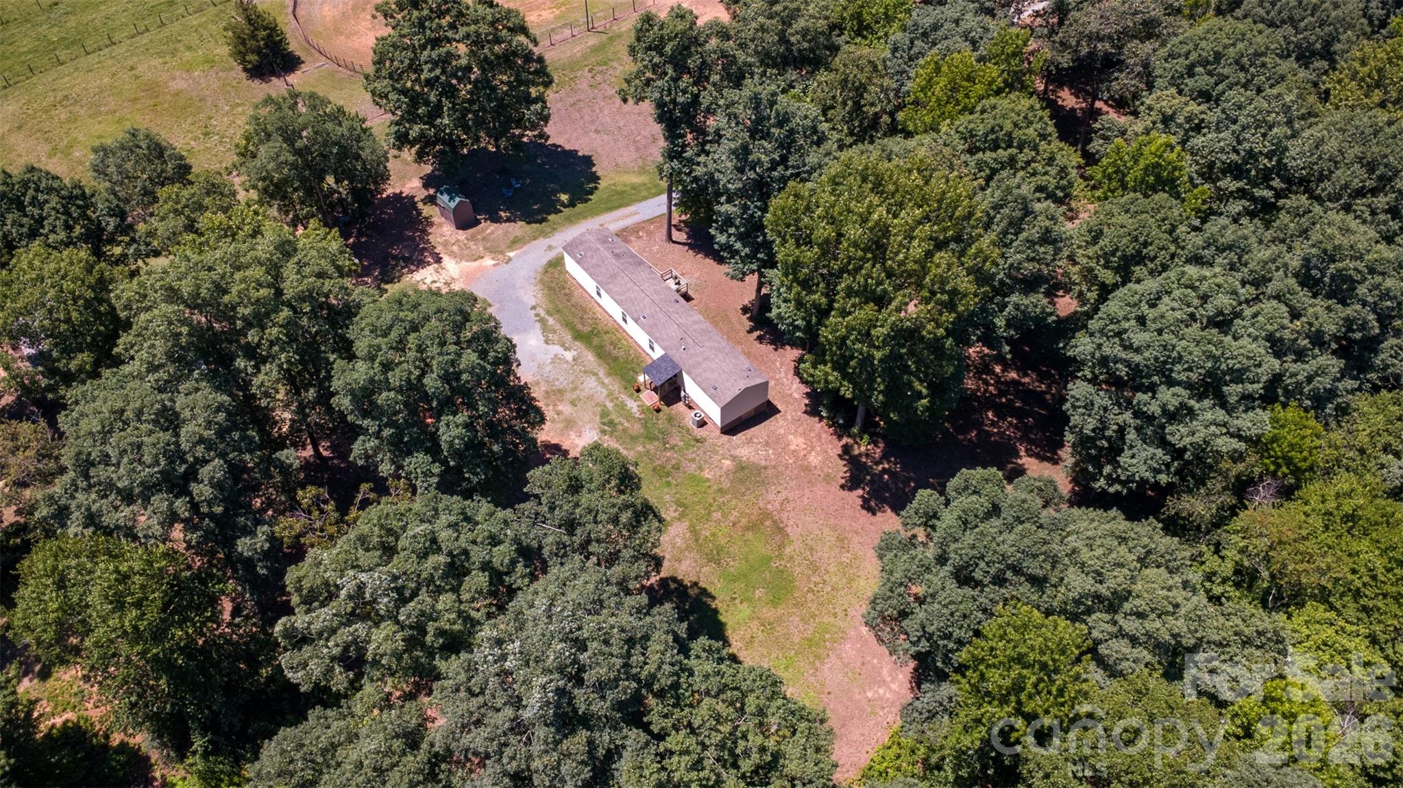 4406 Lucy Short Cut Road Marshville, NC 28103 - Photo 29 of 30 an aerial view of residential house with outdoor space and trees all around