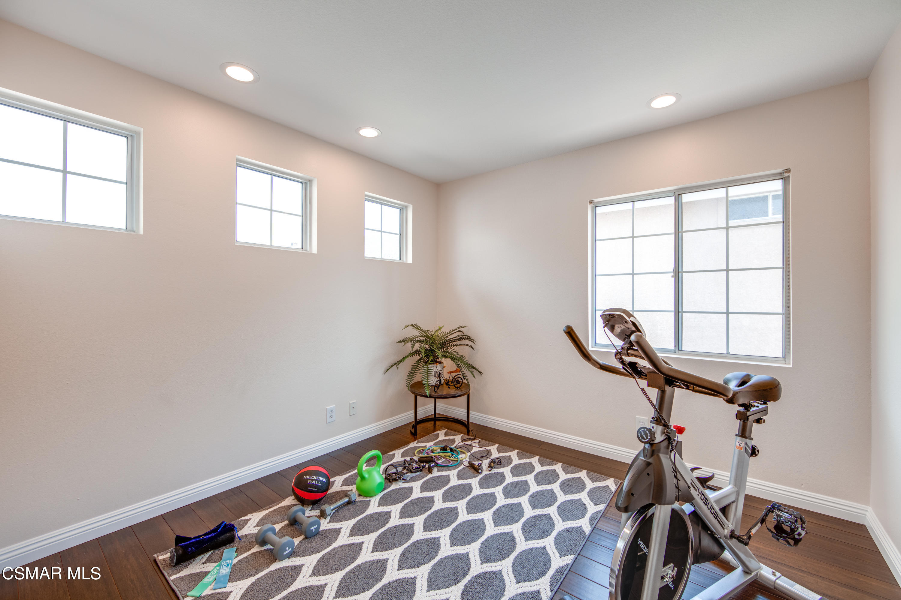 1763 Empty Saddle Road Simi Valley, CA 93063 - Photo 22 of 36 a room with gym equipment and windows