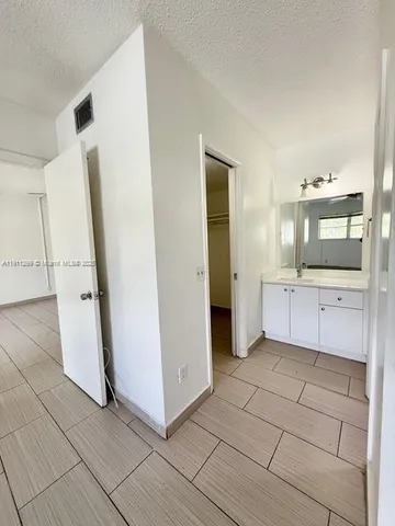 a view of a utility room with kitchen