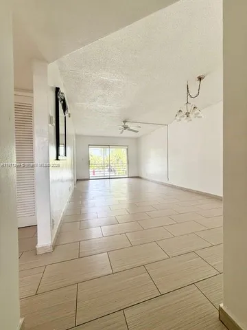 a view of a hallway with white walls