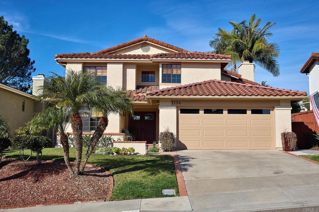 1134 Calle Christopher Encinitas, CA 92024 - Photo 1 of 37 a front view of a house with garden