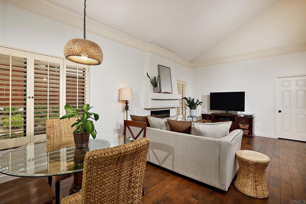 1134 Calle Christopher Encinitas, CA 92024 - Photo 11 of 37 a living room with furniture wooden floor and a flat screen tv