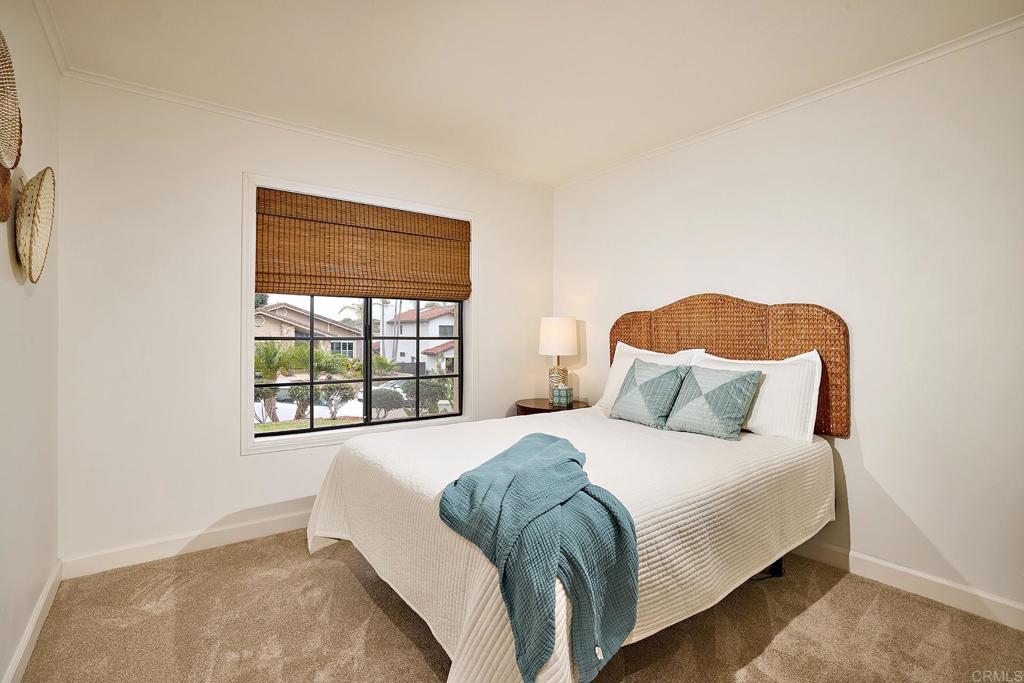 1134 Calle Christopher Encinitas, CA 92024 - Photo 15 of 37 a bedroom with a bed and a window