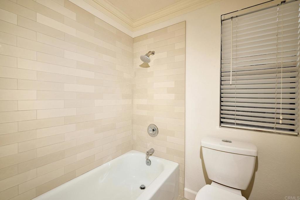 1134 Calle Christopher Encinitas, CA 92024 - Photo 17 of 37 a bathroom with a bathtub and a toilet