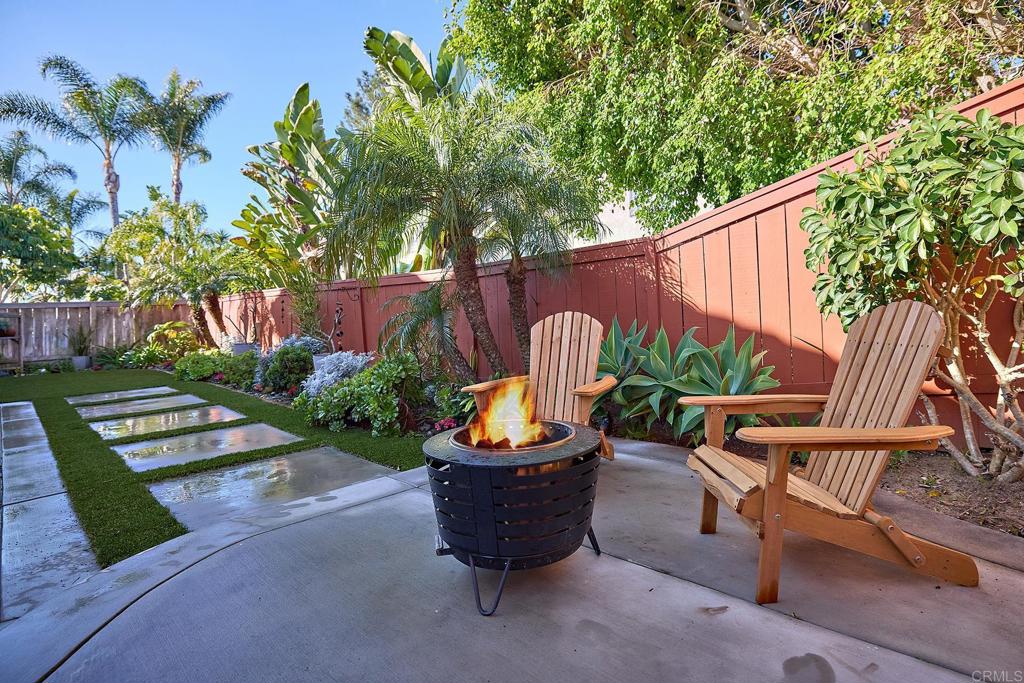 1134 Calle Christopher Encinitas, CA 92024 - Photo 22 of 37 a view of a chairs and table in the backyard a garden