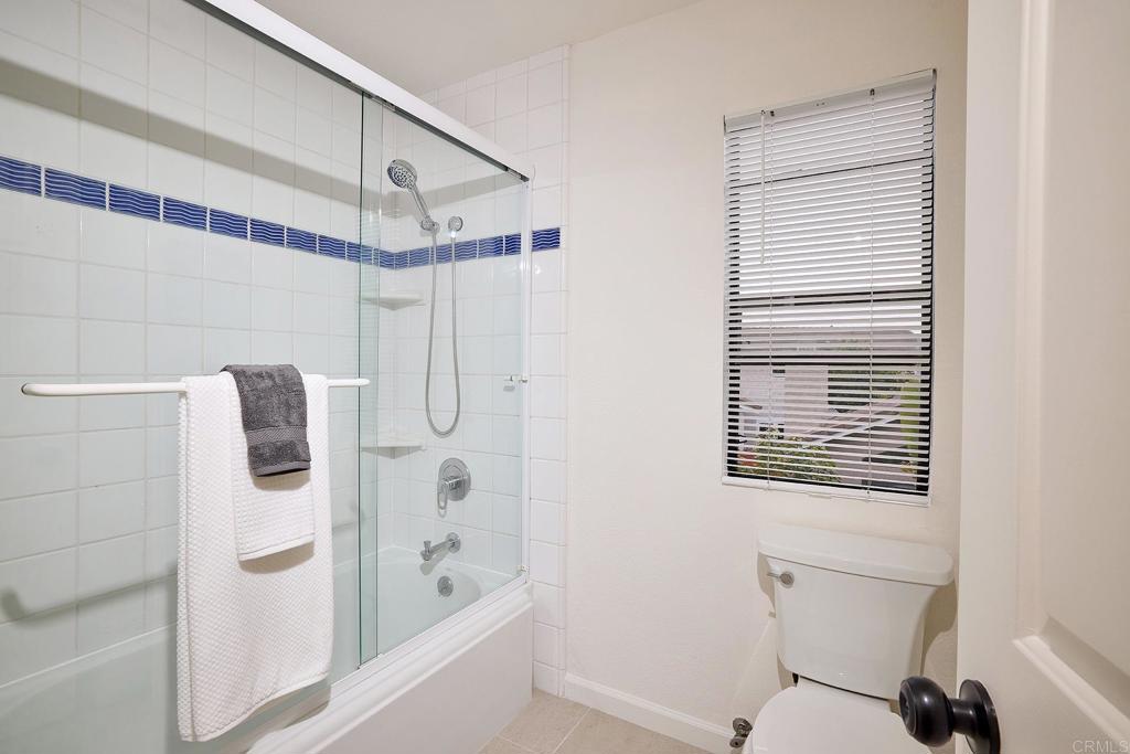 1134 Calle Christopher Encinitas, CA 92024 - Photo 29 of 37 a bathroom with a shower and a toilet