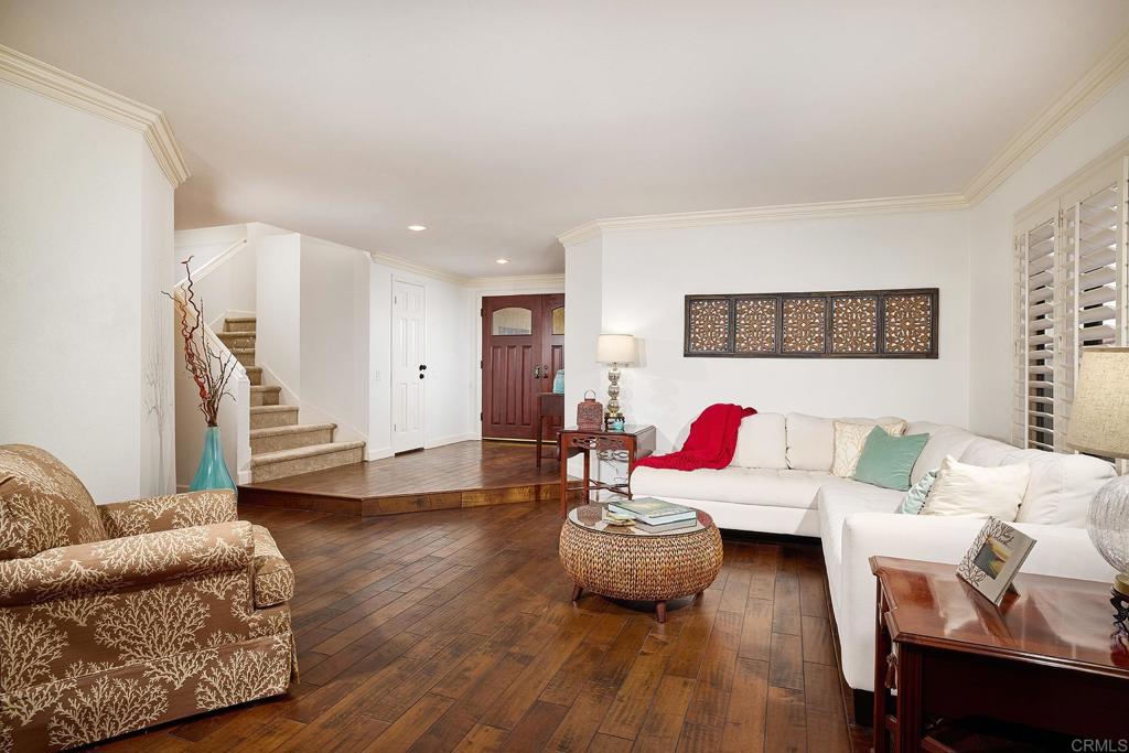 1134 Calle Christopher Encinitas, CA 92024 - Photo 6 of 37 a living room with furniture and a wooden floor