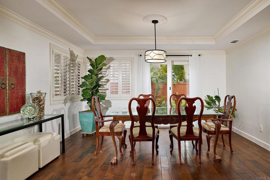 1134 Calle Christopher Encinitas, CA 92024 - Photo 7 of 37 a view of a dining room with furniture window and wooden floor