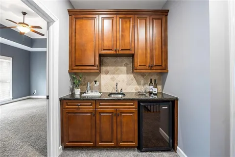 a kitchen with a sink and cabinets