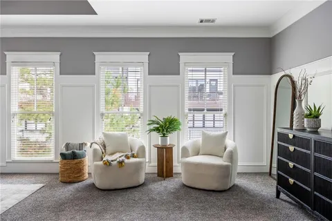 a living room with furniture and windows