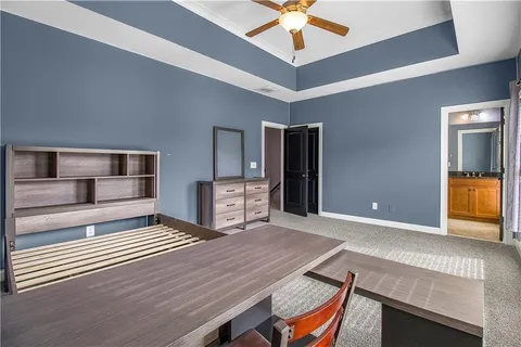 a living room with stainless steel appliances kitchen island granite countertop furniture and a kitchen view