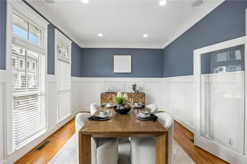 a view of a dining room with furniture and a window