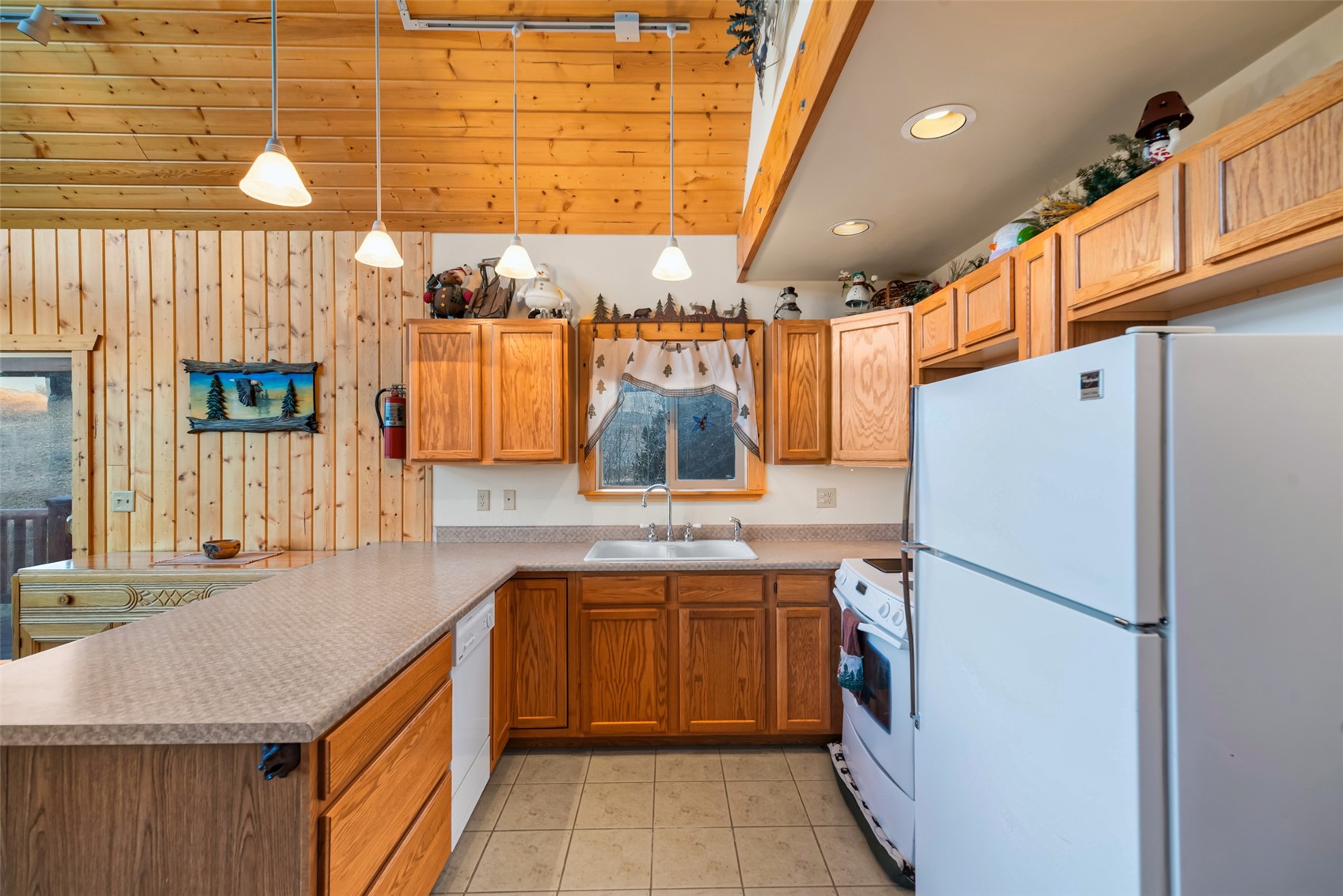 1081 Travois Road Como, CO 80456 - Photo 13 of 44 a kitchen with a sink dishwasher a refrigerator and a stove