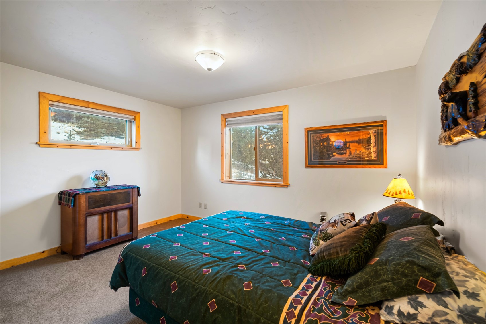 1081 Travois Road Como, CO 80456 - Photo 16 of 44 a bedroom with a bed and painting on the wall