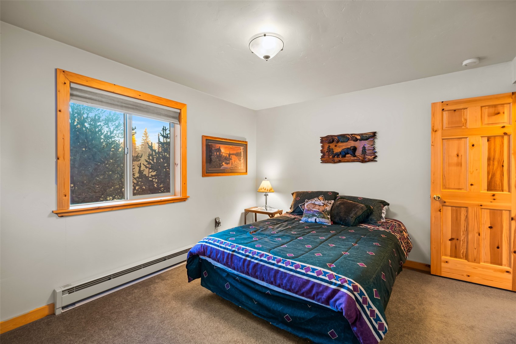 1081 Travois Road Como, CO 80456 - Photo 17 of 44 a bedroom with a bed and wooden floor