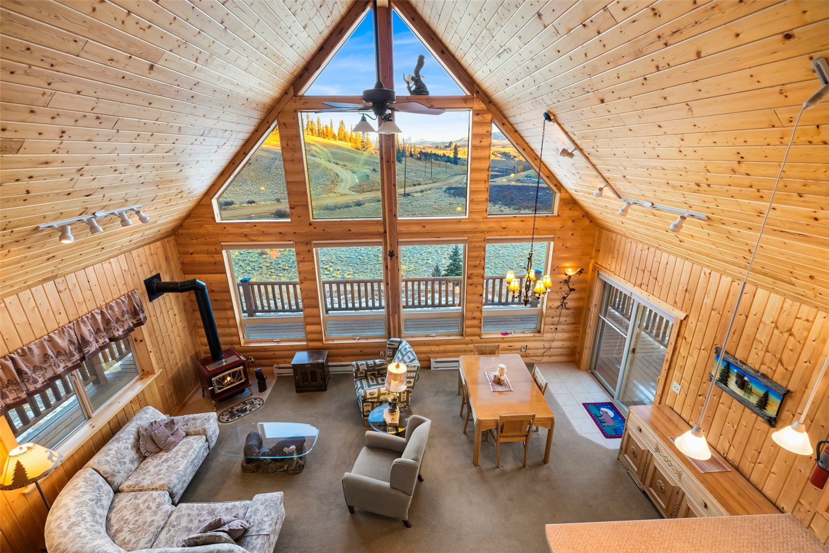 1081 Travois Road Como, CO 80456 - Photo 23 of 44 a living room with furniture and a floor to ceiling window