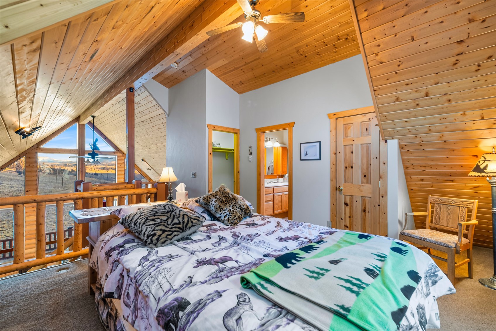 1081 Travois Road Como, CO 80456 - Photo 26 of 44 a bedroom with a bed a dresser next to a window