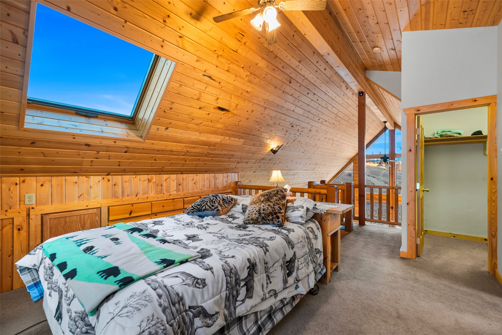 1081 Travois Road Como, CO 80456 - Photo 27 of 44 a bed sitting in a bedroom next to a window