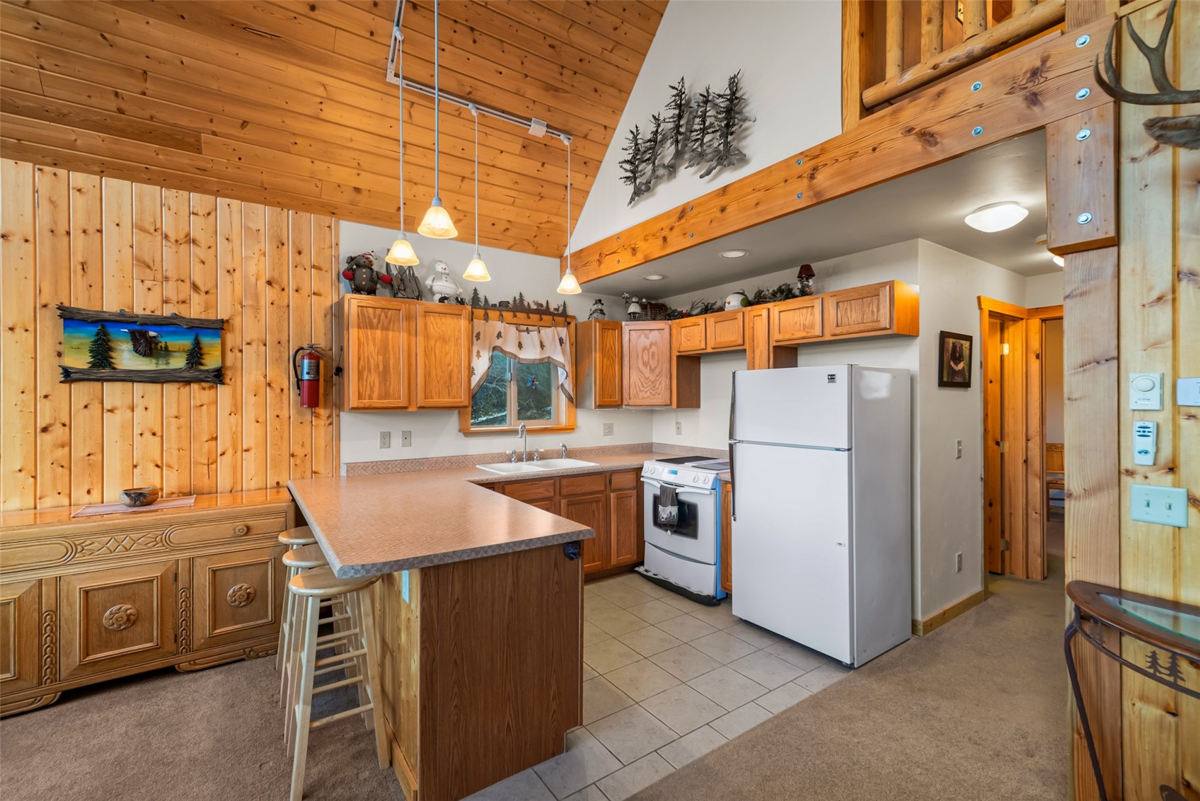 1081 Travois Road Como, CO 80456 - Photo 3 of 44 a utility room with refrigerator and washer