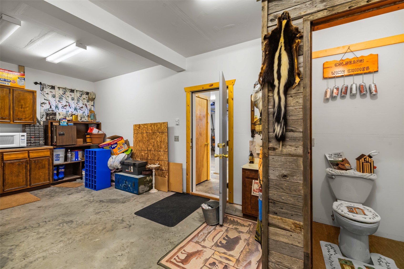 1081 Travois Road Como, CO 80456 - Photo 44 of 44 a living room with furniture and a flat screen tv
