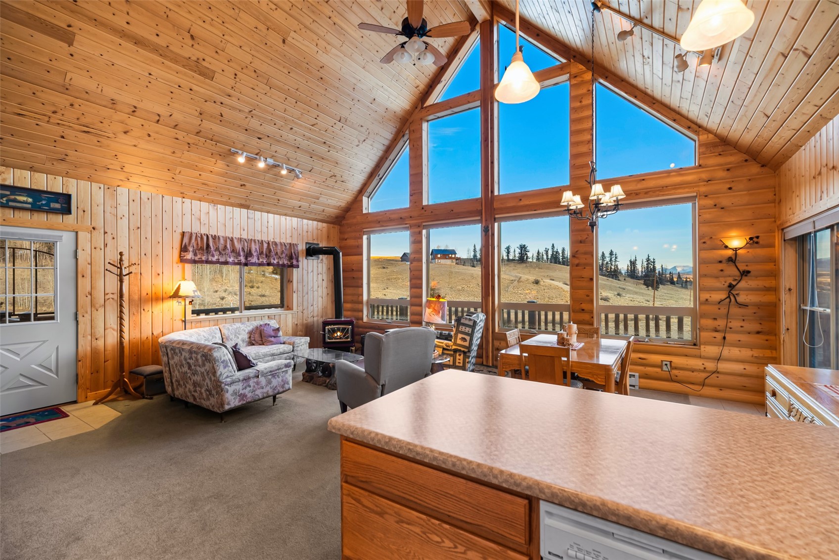 1081 Travois Road Como, CO 80456 - Photo 9 of 44 a living room with furniture and large windows