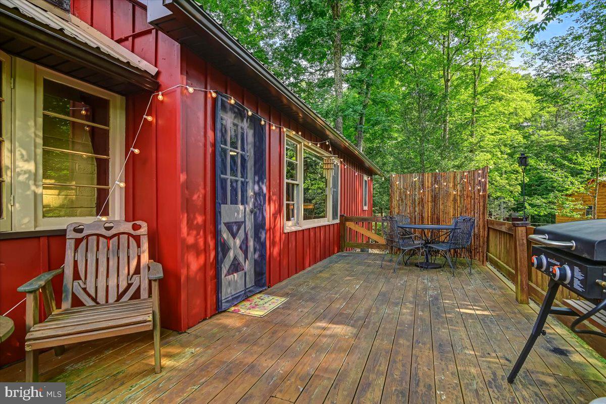112 Beechwood Cove Road Greentown, PA 18426 - Photo 5 of 59 a view of backyard with deck and outdoor seating