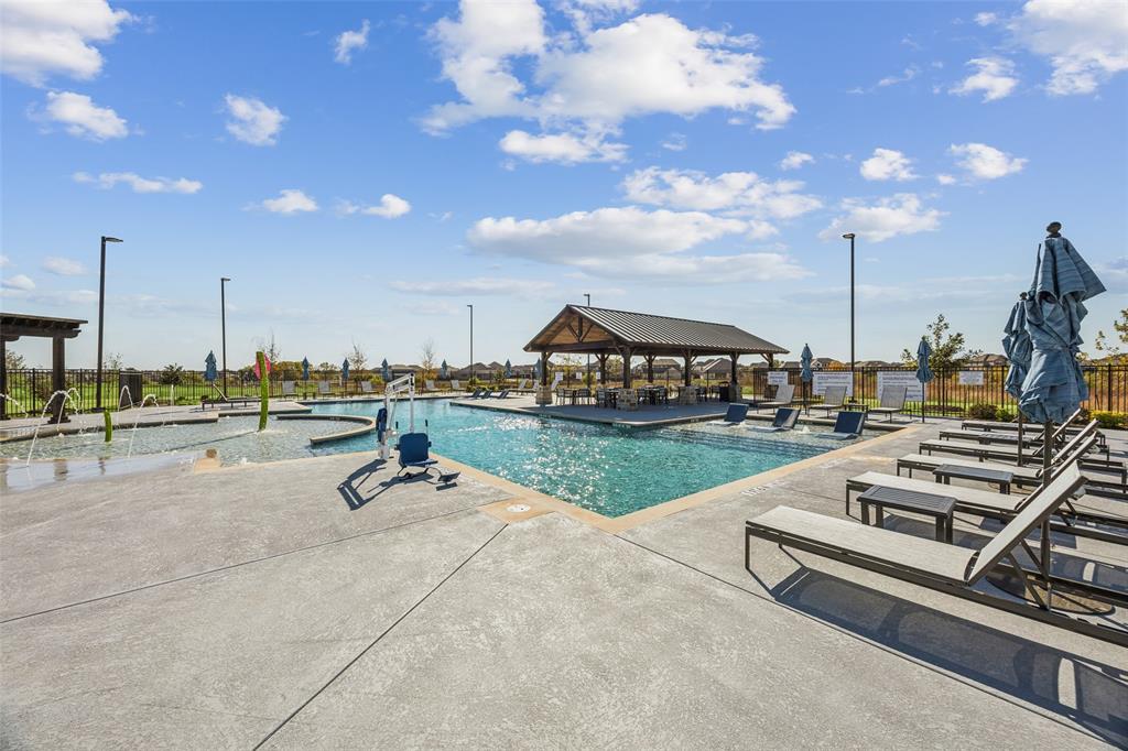 15024 Horseshoe Post Road Fort Worth, TX 76052 - Photo 29 of 31 a view of a swimming pool and lounge chairs