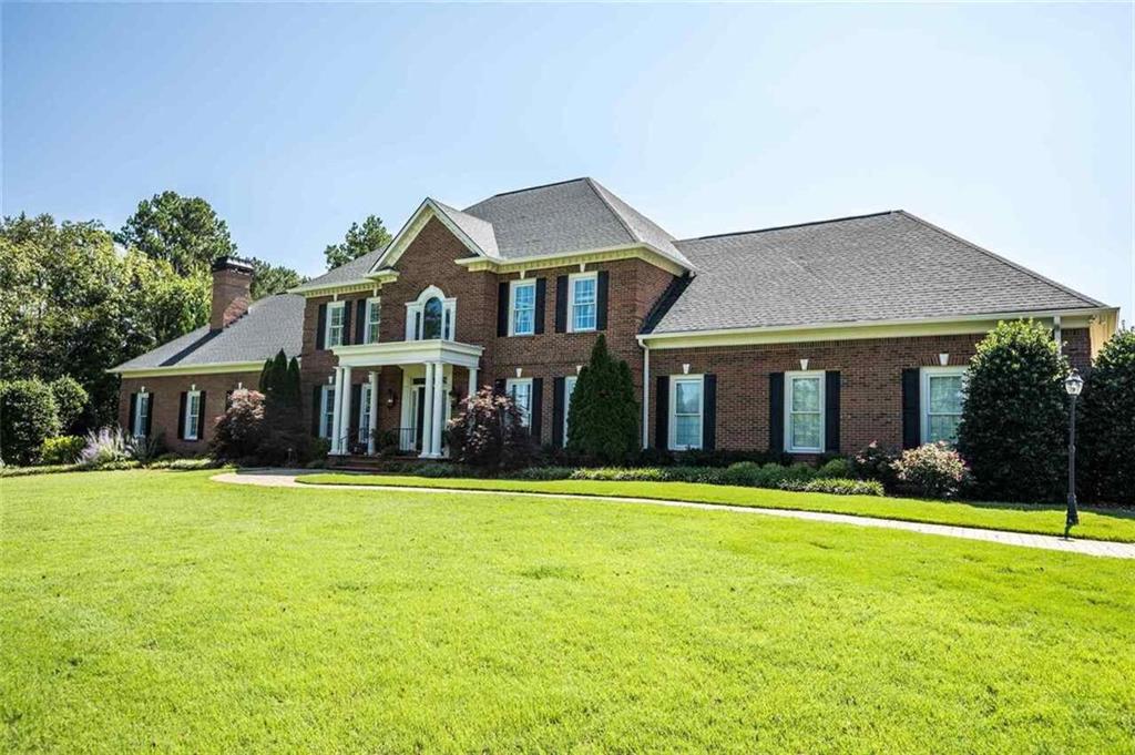 339 Reynolds Bend Road Southeast Rome, GA 30161 - Photo 1 of 1 a front view of a house with a yard