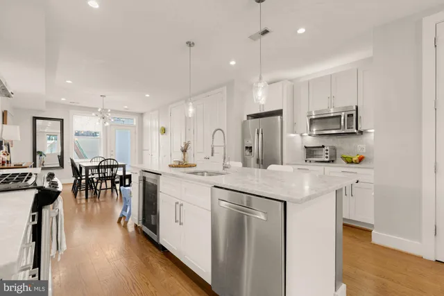 a kitchen with lots of counter top space and living room