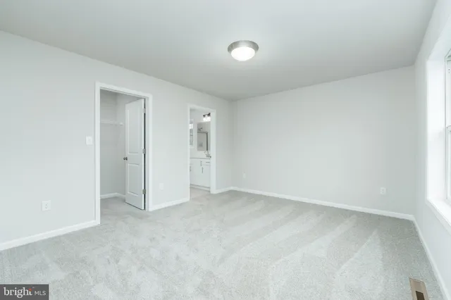 an empty room with a bathroom