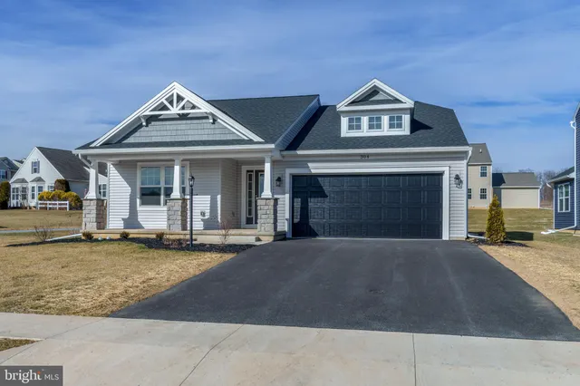 a front view of a house with yard