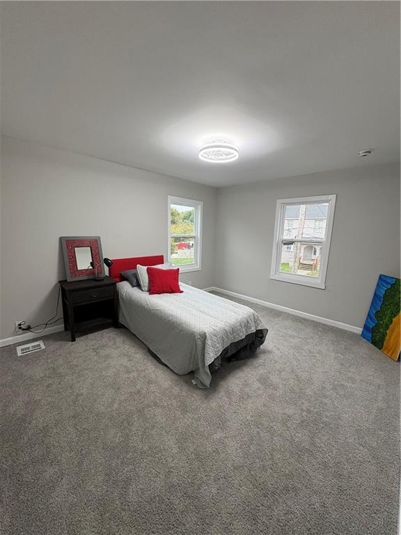 1106 Wade Street Aliquippa, PA 15001 - Photo 19 of 32 a spacious bedroom with a bed and a window