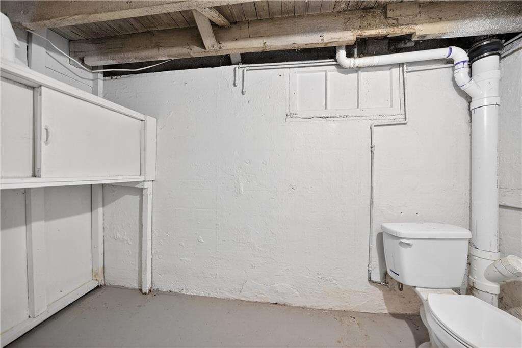 1106 Wade Street Aliquippa, PA 15001 - Photo 23 of 32 a white toilet sitting next to a shower