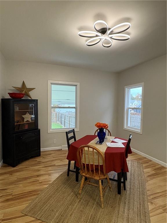 1106 Wade Street Aliquippa, PA 15001 - Photo 7 of 32 a view of a dining room with furniture and chandelier