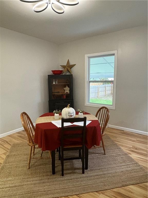 1106 Wade Street Aliquippa, PA 15001 - Photo 8 of 32 a view of a dining room with furniture and wooden floor