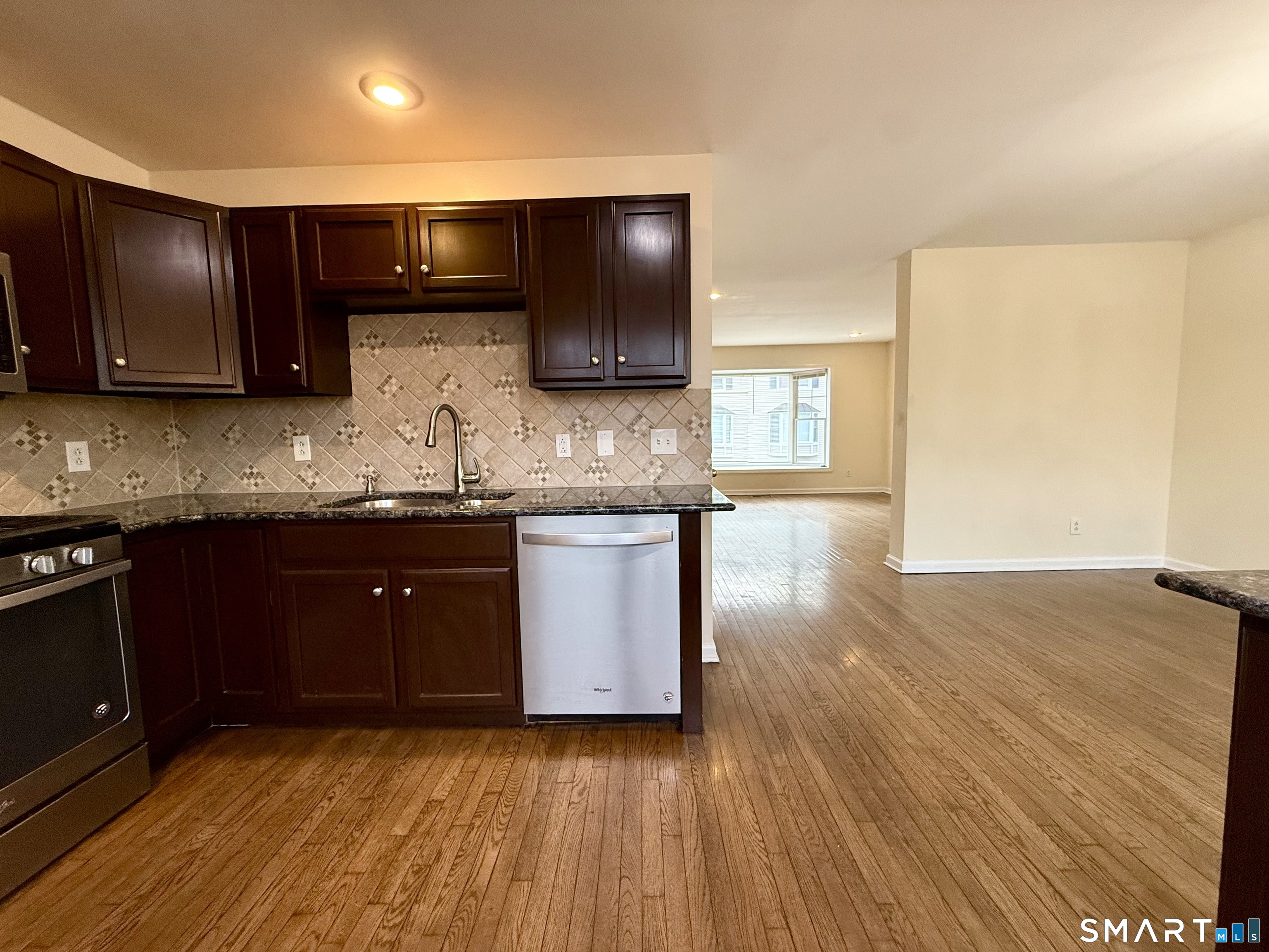 15 Scuppo Road, Unit 603 Danbury, CT 06811 - Photo 13 of 29 a kitchen with stainless steel appliances granite countertop wooden cabinets a oven a stove and a granite countertops