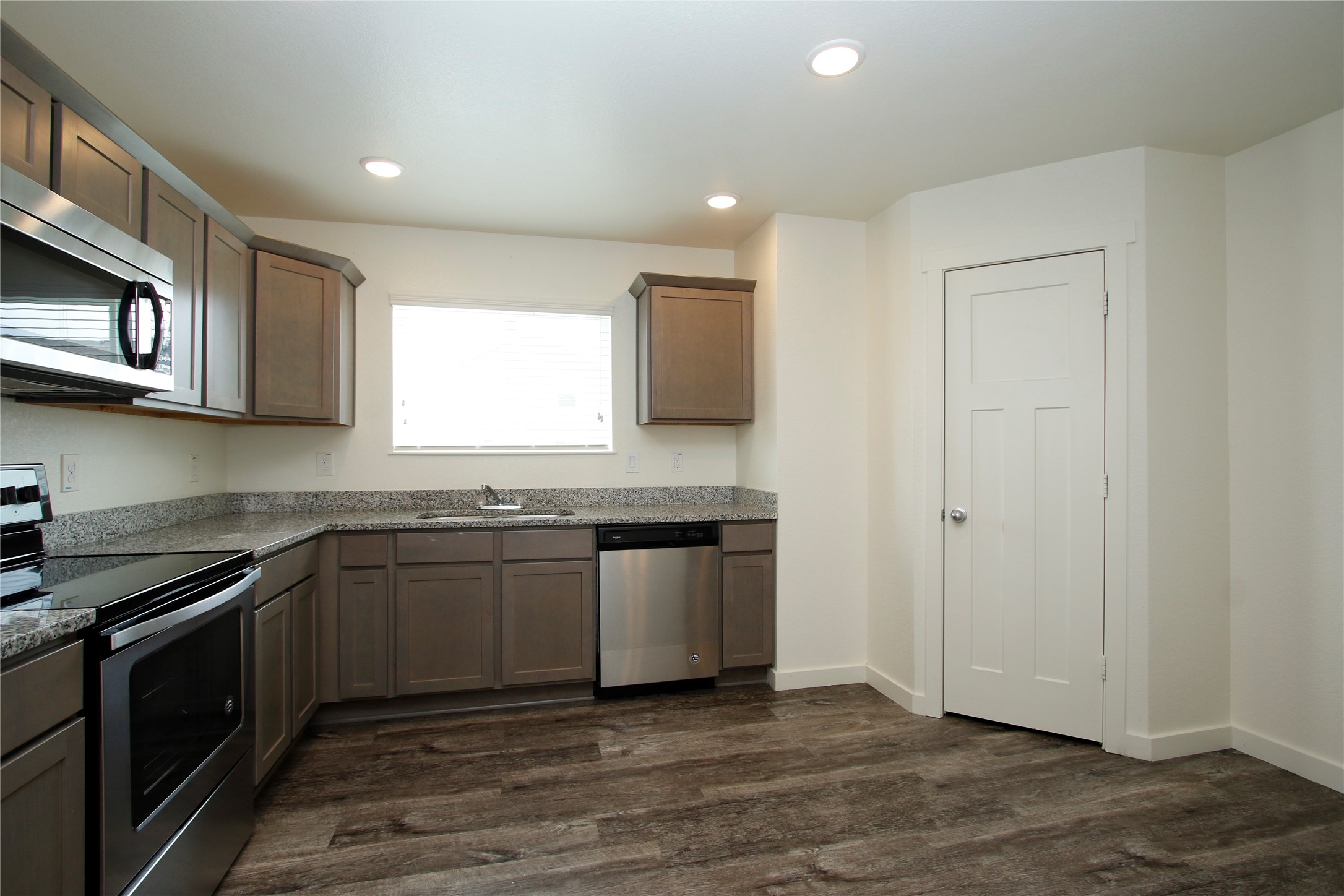 21155 Gosling Road, Unit 22A Spring, TX 77388 - Photo 11 of 28 a kitchen with stainless steel appliances granite countertop a stove and a microwave