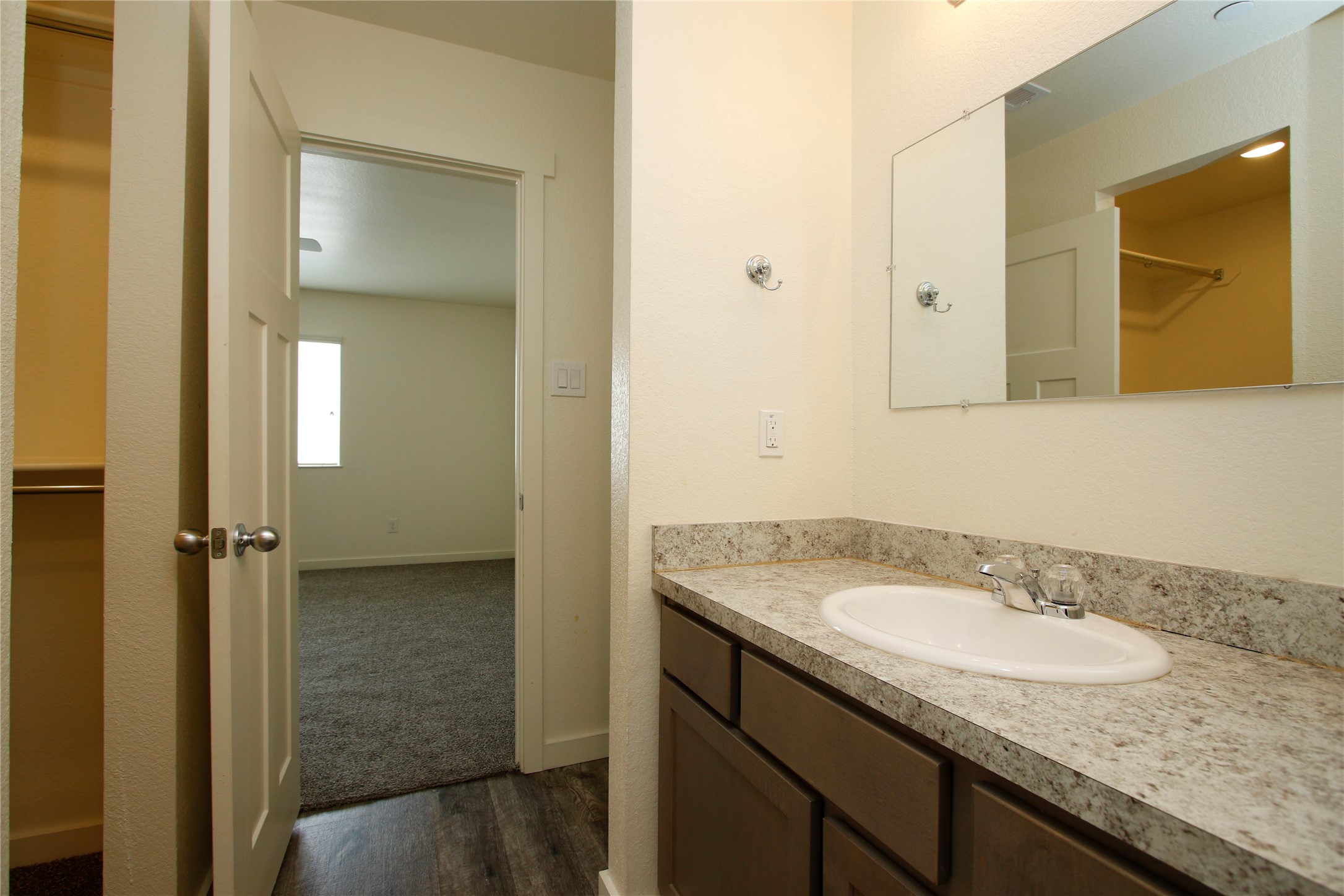 21155 Gosling Road, Unit 22A Spring, TX 77388 - Photo 17 of 28 a bathroom with a granite countertop sink and a mirror