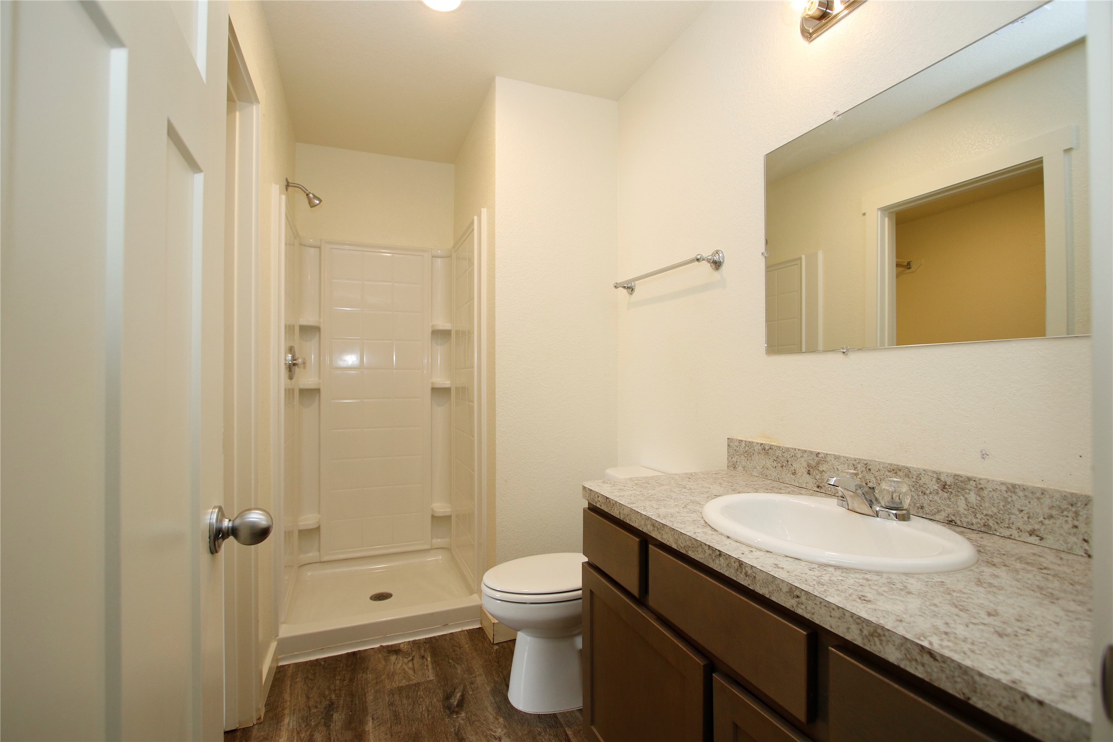 21155 Gosling Road, Unit 22A Spring, TX 77388 - Photo 21 of 28 a bathroom with a granite countertop sink toilet and shower