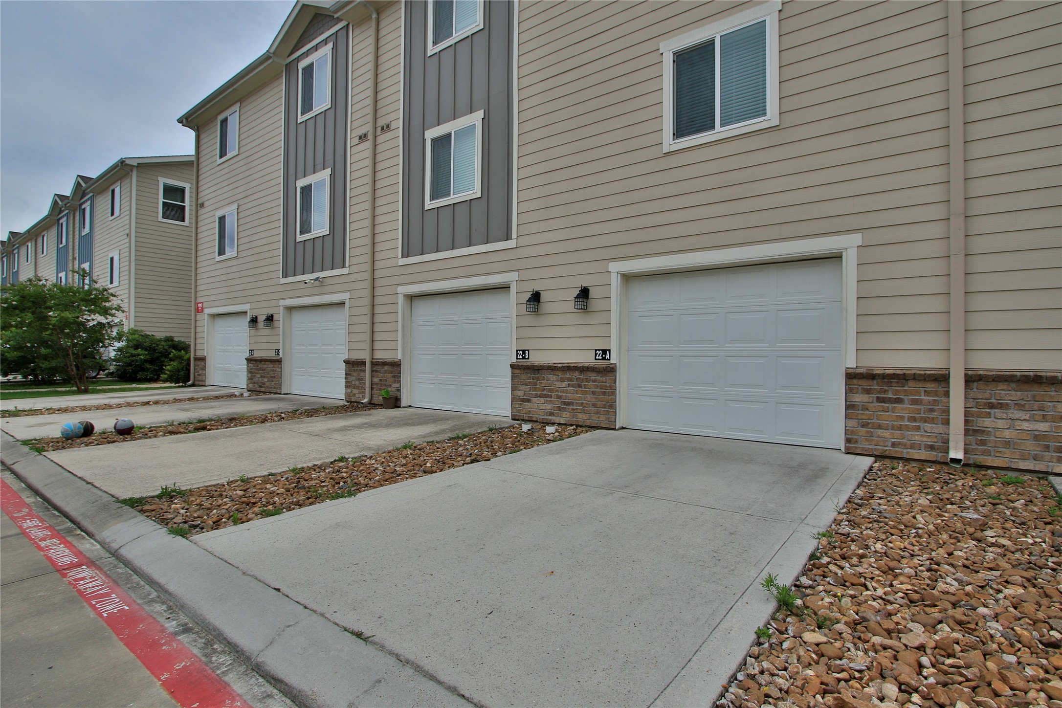 21155 Gosling Road, Unit 22A Spring, TX 77388 - Photo 27 of 28 a front view of a house with a yard