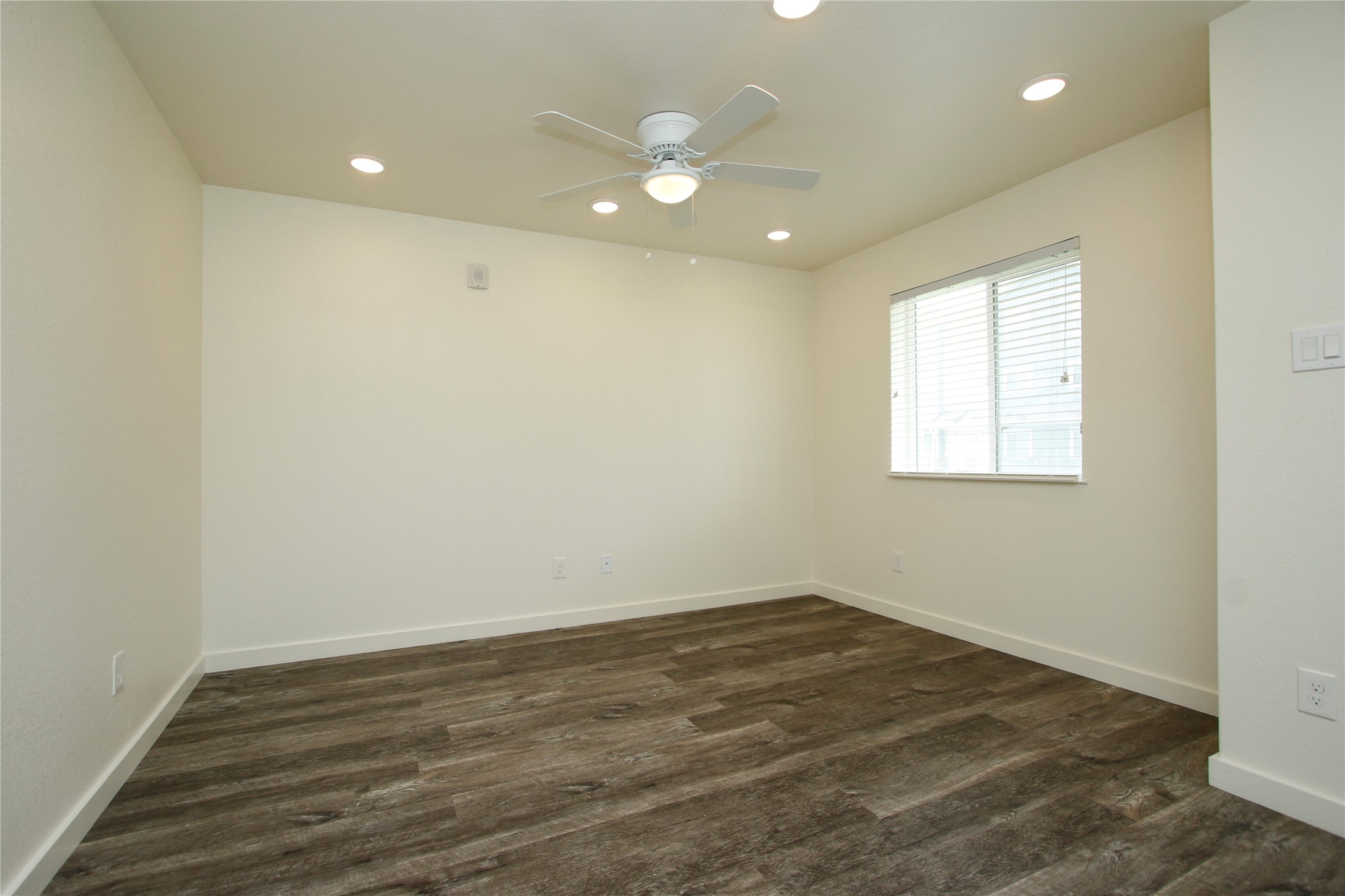 21155 Gosling Road, Unit 22A Spring, TX 77388 - Photo 4 of 28 an empty room with wooden floor and windows