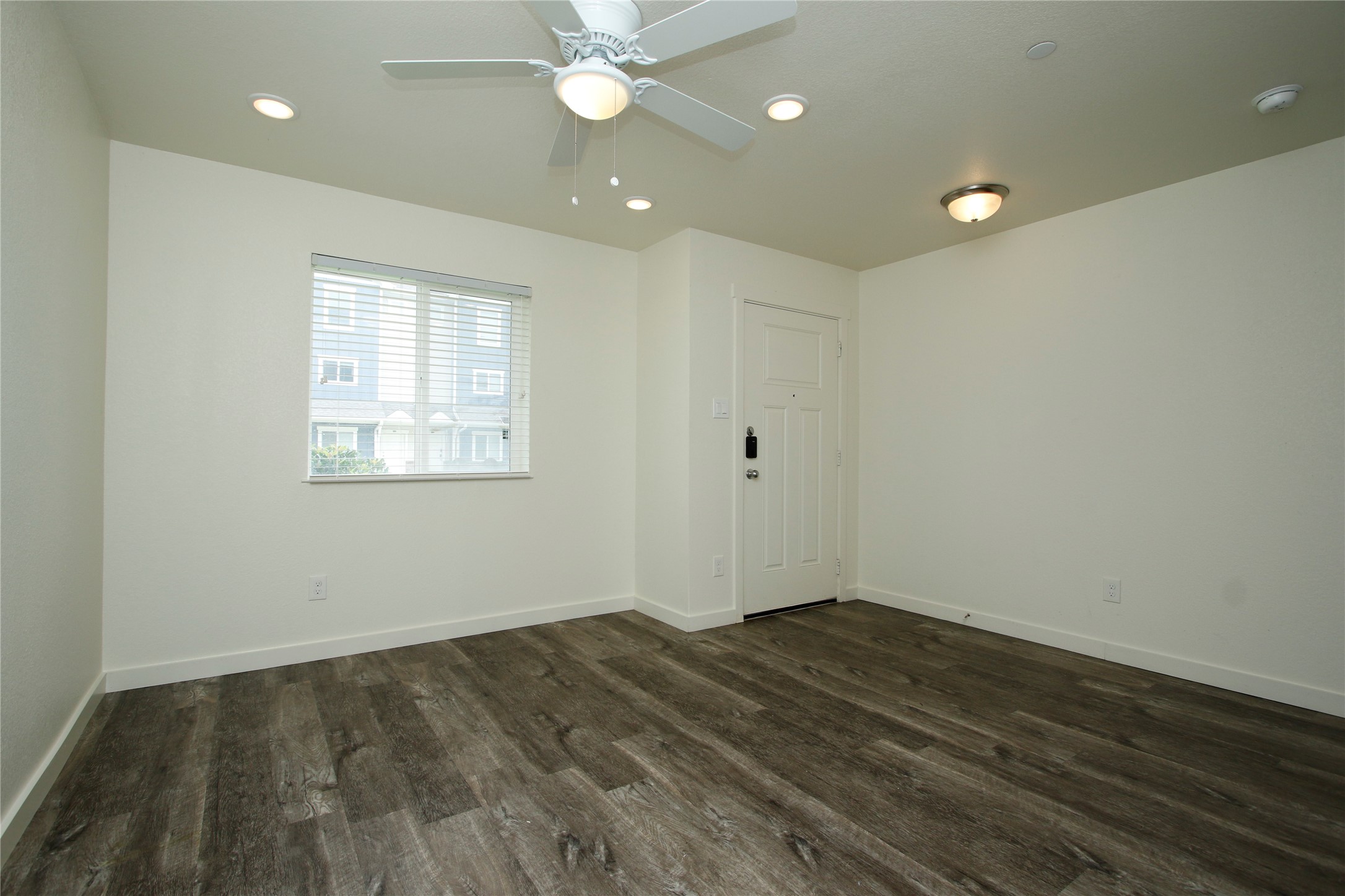 21155 Gosling Road, Unit 22A Spring, TX 77388 - Photo 5 of 28 wooden floor in an empty room with a window