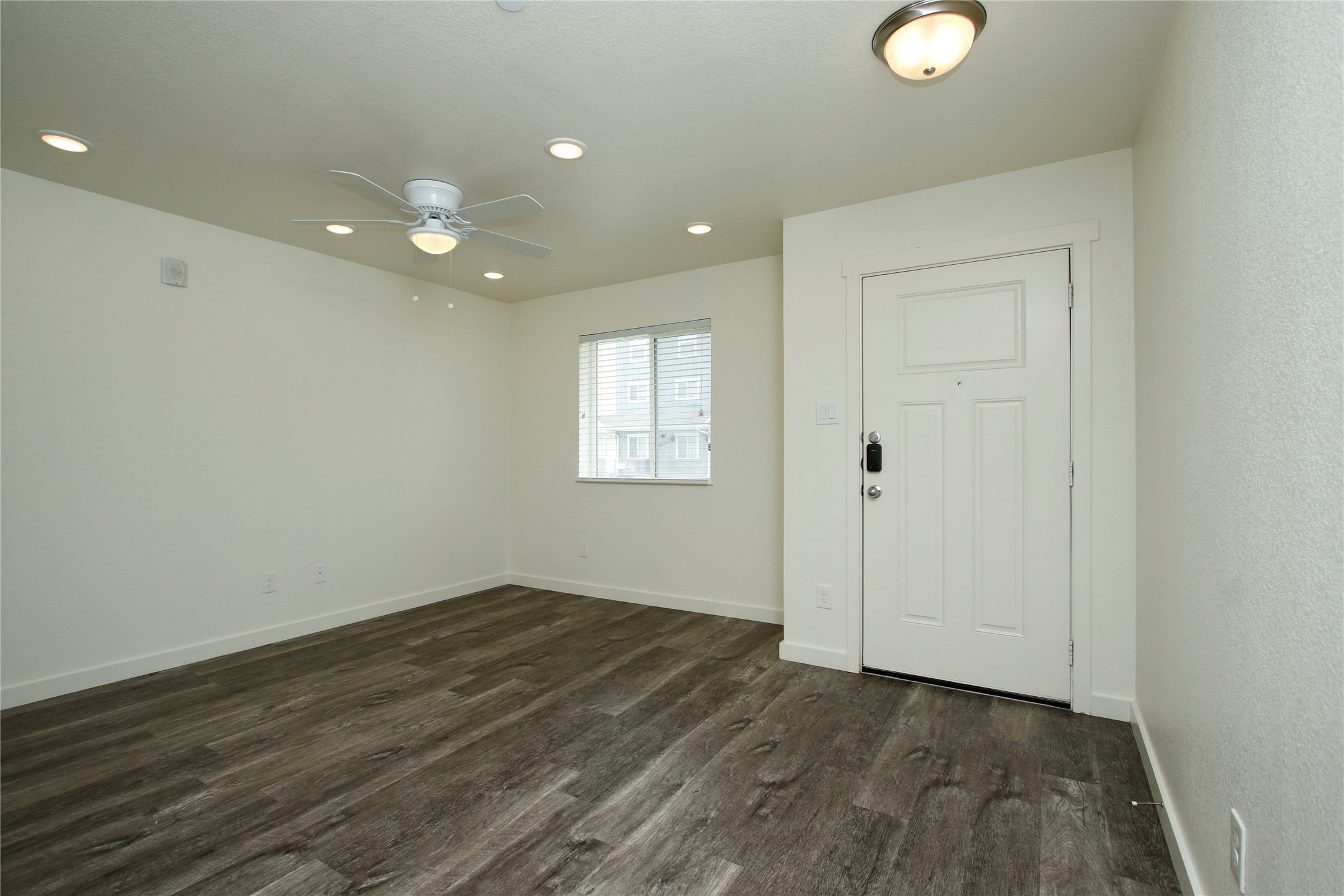 21155 Gosling Road, Unit 22A Spring, TX 77388 - Photo 6 of 28 an empty room with wooden floor and windows