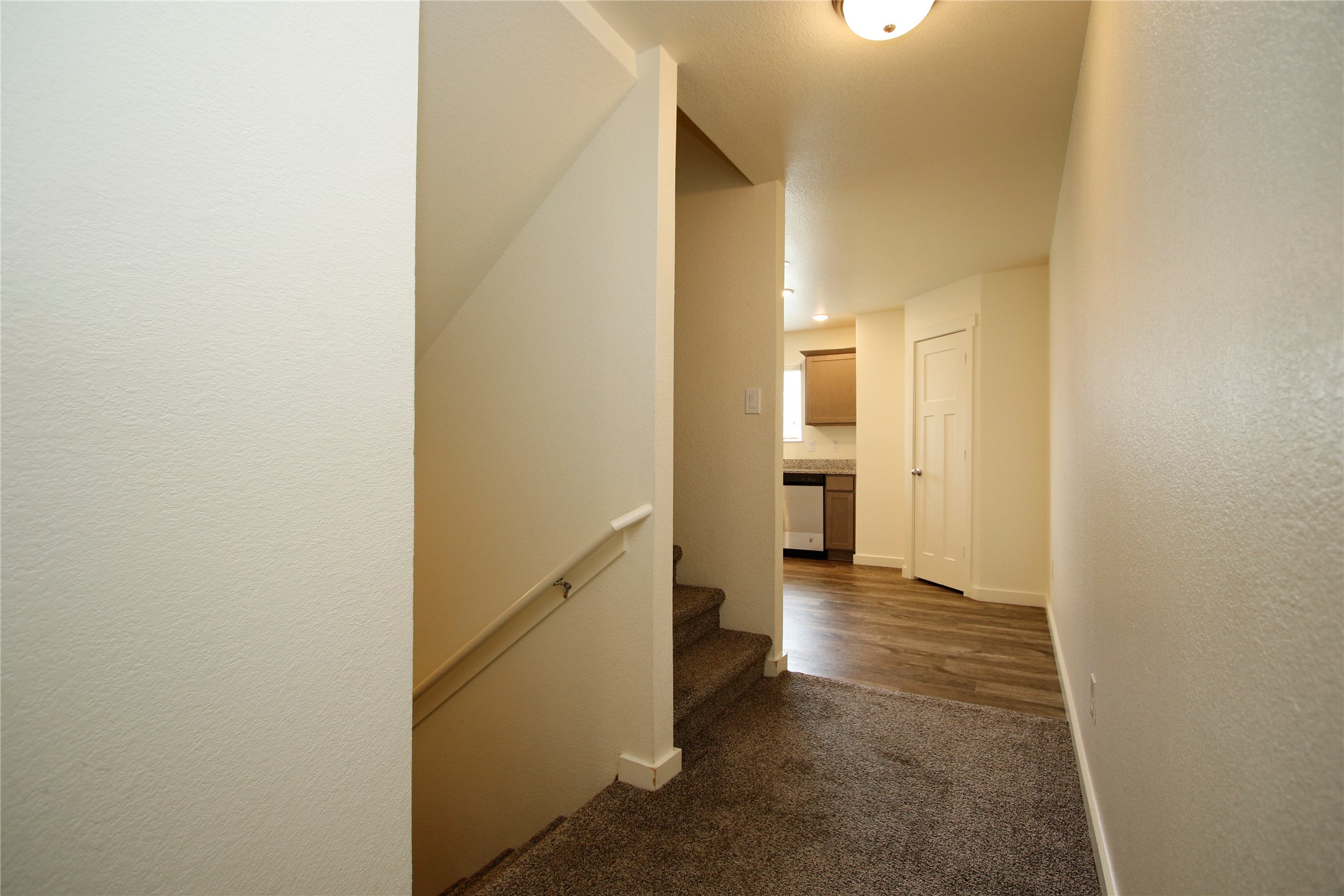 21155 Gosling Road, Unit 22A Spring, TX 77388 - Photo 8 of 28 a view of a hallway with an empty room and wooden floor