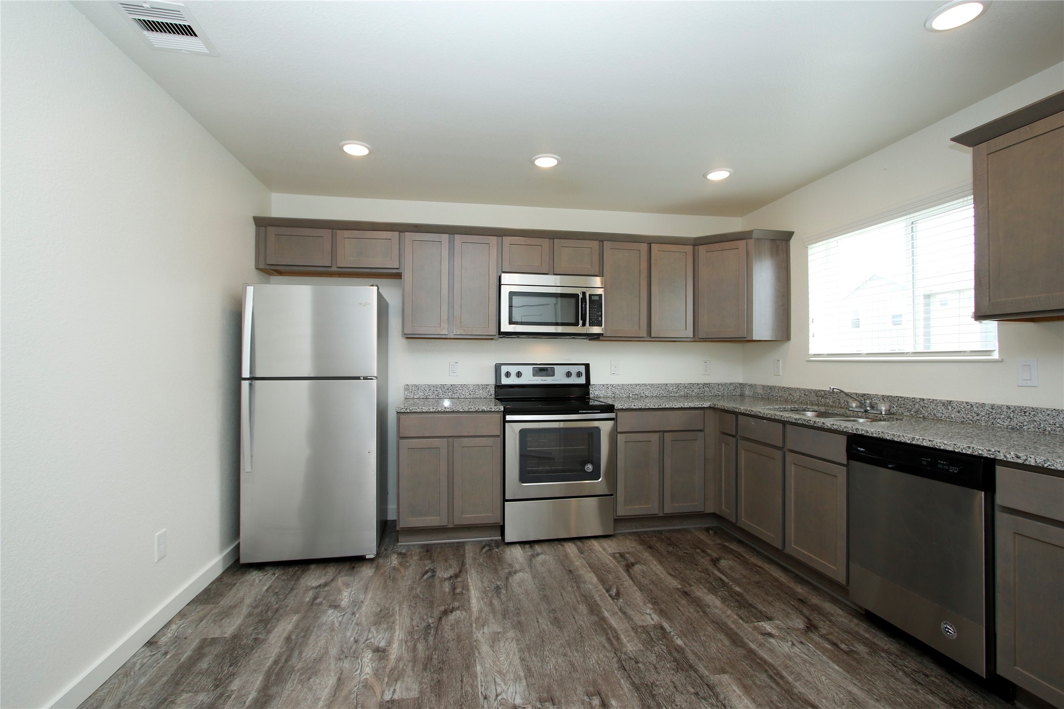 21155 Gosling Road, Unit 22A Spring, TX 77388 - Photo 10 of 28 a kitchen with a refrigerator and a sink