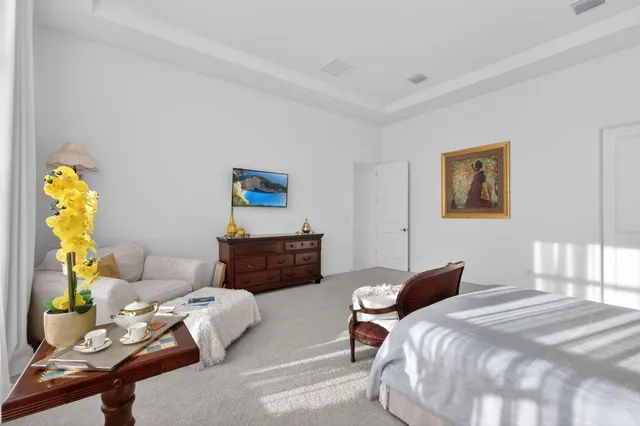 a bathroom with a granite countertop sink a toilet a mirror and shower